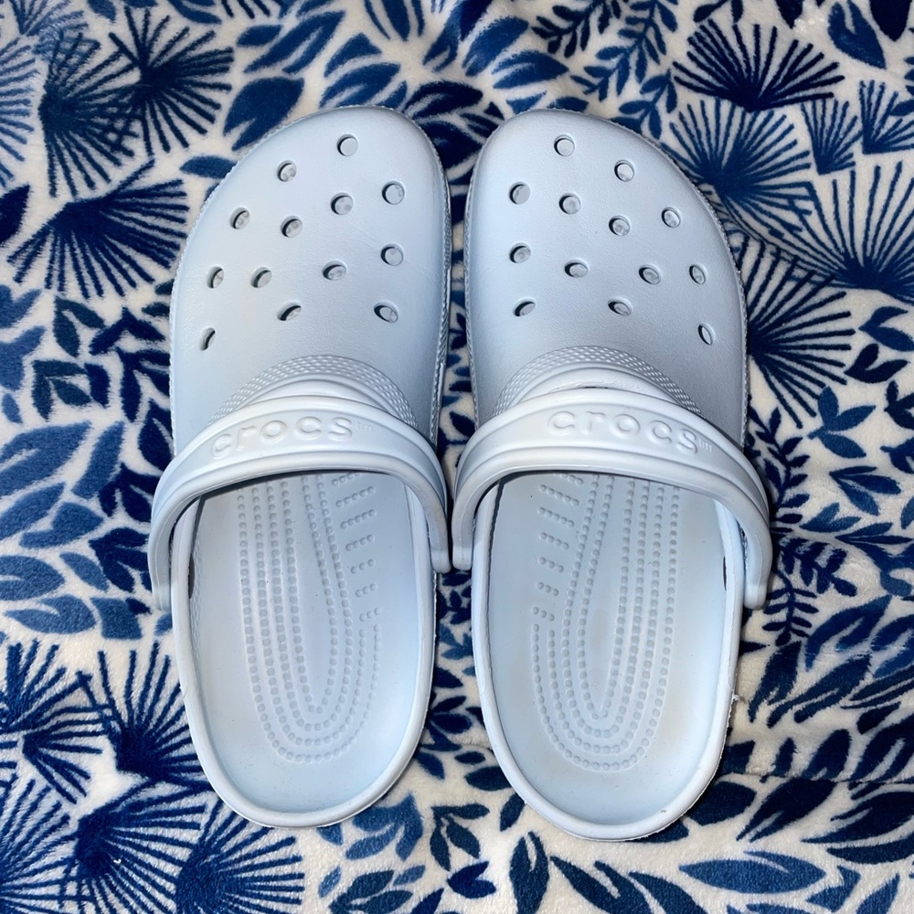 Light blue crocs in great condition.